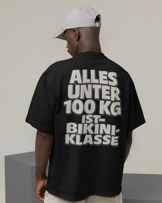Rückansicht des „Alles unter 100 kg“-T-Shirts, locker fallend im Oversized Schnitt

