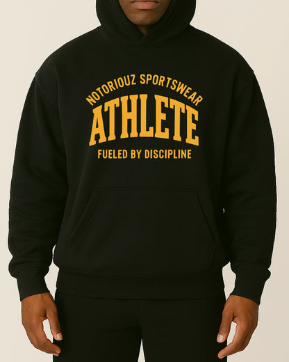 ATHLETE Hoodie – Fueled by Discipline von Notoriouz Sportswear in Schwarz, Oversize Gym Hoodie im College-Style
